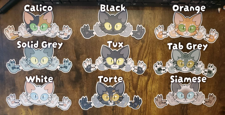 9 cat signing "Cat" in ASL stickers, each have different color and labeled accordingly of the following from top-left row toward bottom-right. 3x3 rows. Calico, Black, Orange, Solid Grey, Tux, Tab Grey, Whtie, Torte, and Siamese.